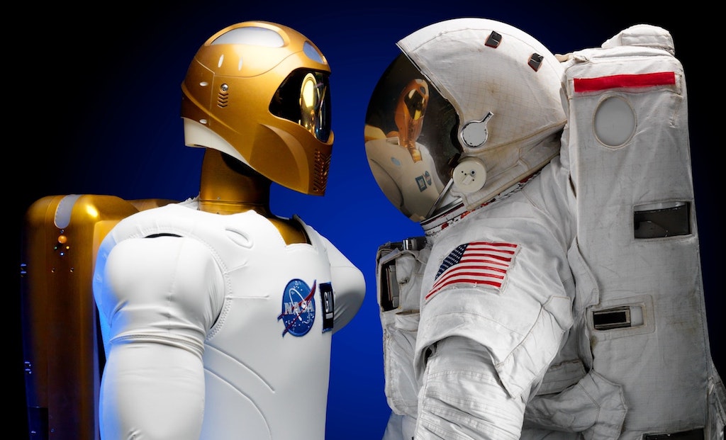An AI robot meets a human astronaut