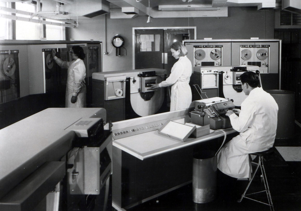 In the 1966 the Met Office was using the English Electric KDF9 (Lyons Electronic Office) computer installation pictured here in its former headquarters at Bracknell 