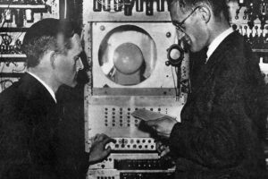 Freddie Williams and Tom Kilburn, the inventors of the Baby shown programming the Manchester Mk 1 computer