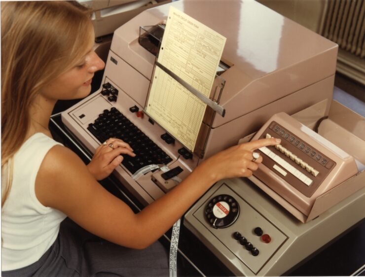Female using telex broadcast unit. Telex machine; teleprinter receiver and key and lamp switching unit